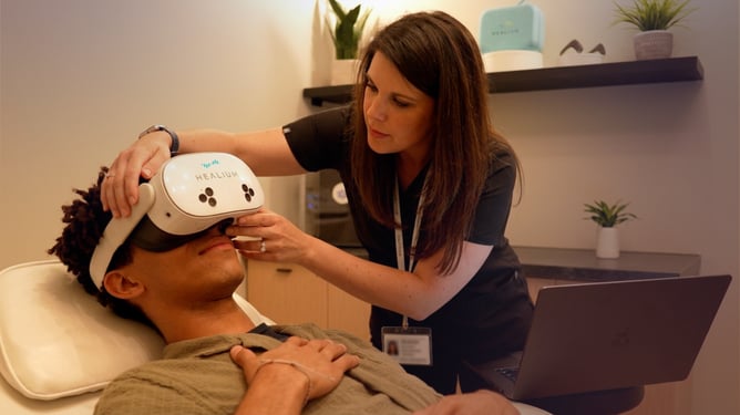 Clinician Helping Patient into Healium