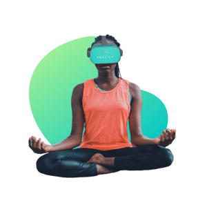 woman sitting cross legged with vr goggles