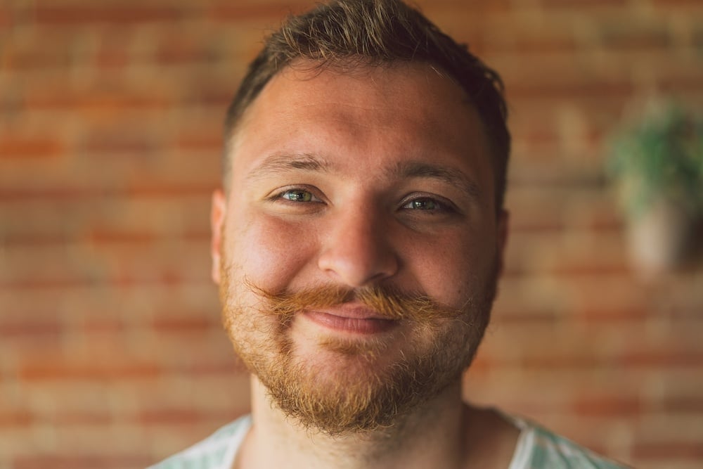 close up portrait of handsome manly guy with beard
