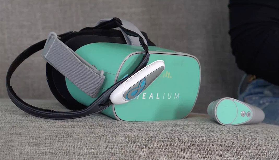 Oculus Go headset with a BrainLink Lite EEG headband resting on the top