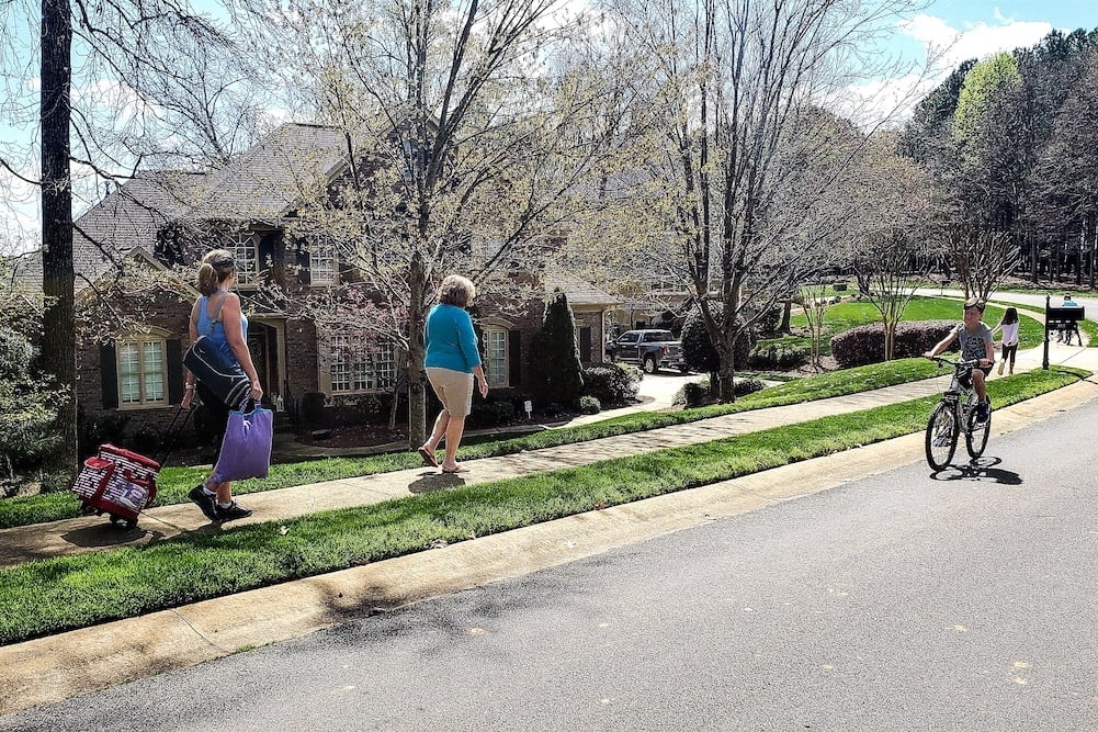 family walking in the neighborhood