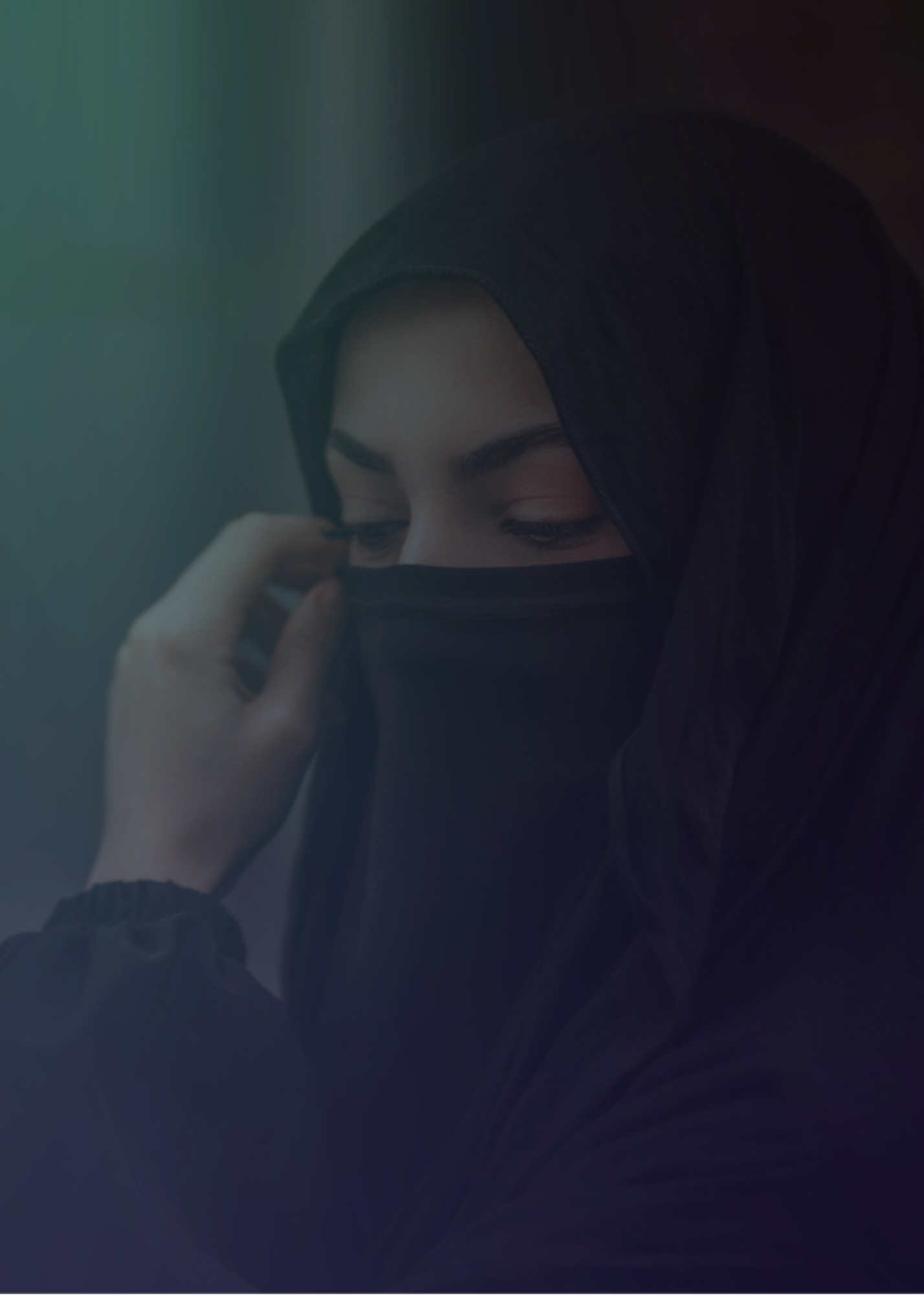 Woman looks down off camera in distress while her hand touches her face. Woman looks down off camera in distress while her hand touches her face.