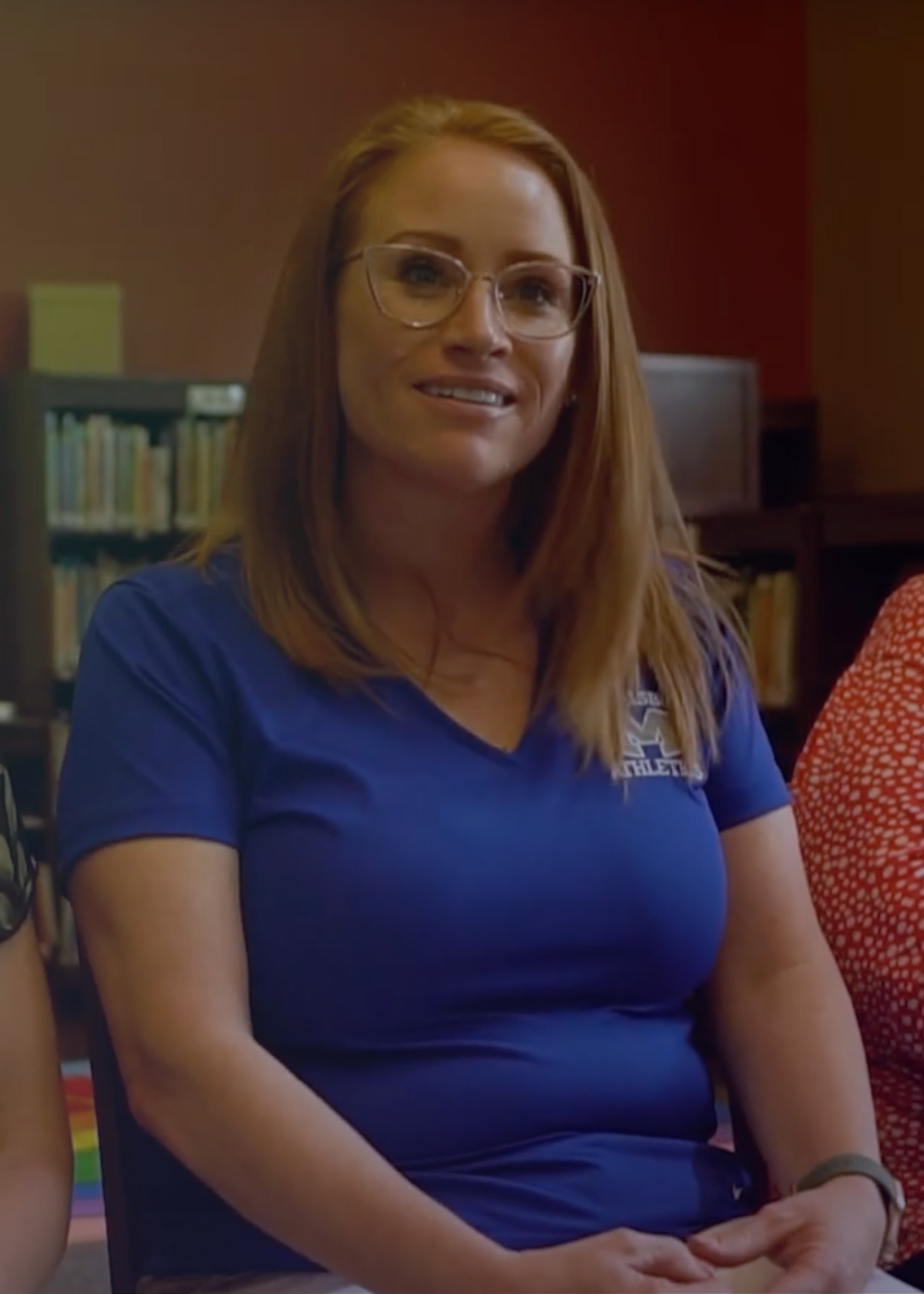 Rebecca Huber, Kinder Elementary Prinicpal, smiling towards the camera. Huber is in a blue shirt, with straight red hair and is wearing glasses. Rebecca Huber, Kinder Elementary Prinicpal, smiling towards the camera. Huber is in a blue shirt, with straight red hair and is wearing glasses.
